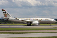 A6-EYI @ EGCC - With titling for the Abu Dhabi Grand Prix - by Howard J Curtis