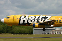 EI-CJC @ EGHH - Close up as it lands; looking rather tatty by this stage! - by Howard J Curtis