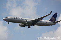 N37427 @ KMCO - United Flight 1427 (N37427) arrives at Orlando International Airport following a flight from Chicago-O'Hare International Airport - by Donten Photography