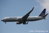 N13248 @ KMCO - United Flight 1176 (N13248) arrives at Orlando International Airport following a flight from Denver International Airport - by Donten Photography