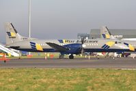 G-BTPC @ EGHH - On cargo ramp with fellow ATP G-MANO - by John Coates