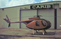 N80225 @ TMB - Hughes 369HS as seen at New Tamiami in November 1979. - by Peter Nicholson