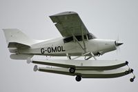 G-OMOL @ EGEO - Unusual to see one with floats. - by Howard J Curtis
