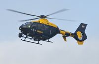 G-WONN @ EGFH - South and East Wales Police Air Support Unit helicopter (Police 32) arriving at Swansea Airport. Marked POLICE on the starboard side. - by Roger Winser