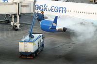 G-JMAA @ EGCC - Thomas Cook B757 G-JMAA having its wings de-iced - by Chris Hall