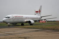 N248SY @ EGHH - ex Qantas VH-TJM taxies to European apron - by John Coates