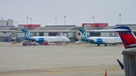 N927AT @ PIT - At the gate at Pittsburgh International (on the left).