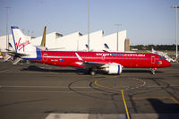 VH-ZPC @ YSSY - Virgin Australia, still in the former Virgin Blue livery, (VH-ZPC) Embraer ERJ-190AR at Sydney Airport. - by YSWG-photography