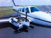 N584MB @ KPKV - Are your landing gear lights telling you for sure? Gear up landing or gear down landing is better than unlocked gear down landing. Two years OOS and $350,000.00 later, this kind of landing will cost you wing end ribs. - by JYINC