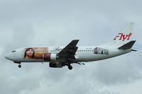 SE-RCR @ ESSA - FlyMe Boeing 737-300 approaching Stockholm Arlanda airport.
Its paintscheme is promoting Robert Wells' Rhapsody in Rock. - by Henk van Capelle