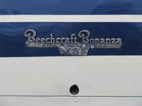 N9753R @ SZP - 1960 Beech M35 BONANZA, Continental IO-470-C 250 Hp, logo - by Doug Robertson