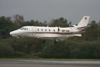 HB-VNI @ EGHH - Just about to touch down on runway 26. Taken from the old museum viewing area. - by Howard J Curtis