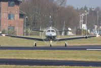 N868AT @ EGHH - Unusual view; about to depart on runway 08. - by Howard J Curtis