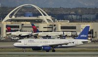 N523JB @ KLAX - Taxiing to gate at LAX - by Todd Royer