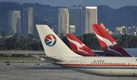 B-6052 @ KLAX - Taxiing to gate at LAX - by Todd Royer