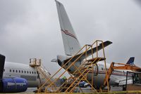EI-EEW @ EGHH - Never flown in this scheme and about to be cut up - by John Coates