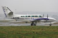G-FIND @ EGHH - Waiting to depart in heavy rain - by John Coates