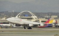 HL7418 @ KLAX - Departing LAX - by Todd Royer
