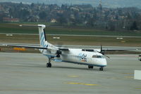 G-JEDU @ LSGG - flybe Dash-8 taxying on one engine - by Chris Hall