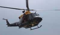 ZJ240 @ EGFH - Hover taxi to hold. - by Derek Flewin