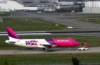 HA-LWO @ LFBO - Freshly painted Airbus A320 without its engines and with test registration F-WWBP, goes to the Airbus assembly workshops at Touloule-Blagnac Airport (LFBO-TLS) - by Yves-Q