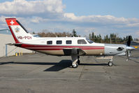 HB-POY @ KPAE - KPAE/PAE Now a PA46T this aircraft arrived from KSFF Felts Field Spokane after being upgraded by Rocket Engineering seen here sitting outside the Sunquest Air Specialties paint shop. - by Nick Dean