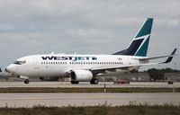 C-FMWJ @ KFLL - Boeing 737-700 - by Mark Pasqualino