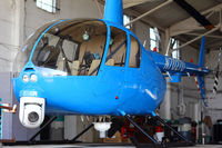 N7027U @ KORL - Sky13 is staring at you from the Showalter hangar. Yes, you. - by PETER CLOSI
