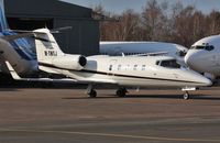 M-TNTJ @ EGHH - Parling up on European ramp with crew for OO-TNQ - by John Coates