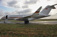 14 04 @ EGHH - Parked in early morning sunlight - by John Coates