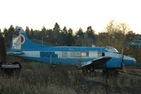 SE-GRA @ ESSP - Still in the livery of its previous owner, Fjällräven, this Dove is standing on the exercise area of the fire brigade of Norrköping Kungsängen airport, in deteriorating condition.