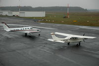 D-IADE @ EDHL - Cessna 340A and a Cessna P210R Centurion parked at  Lübeck Blankensee airport, Germany. - by Henk van Capelle