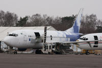 N516WA @ EGHH - A shot of the port side of this ex SAMA Airlines 737 as it slowly meets its end. - by Howard J Curtis