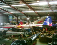 G-CVIX @ EGHH - A view across the engineering hangar at the Bournemouth Aviation Museum. - by Howard J Curtis