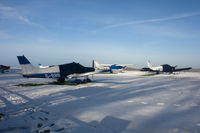G-BRBD @ EGHA - PA.28 G-BRBD, Cessna 182 G-DOVE and PA.28 G-BEYL in the snow. My 5000th aircraft photo on Airport-Data.com. - by Howard J Curtis