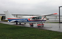 N8243M @ I74 - A spiffy Skylane soaks in the rain at Grimes Field. - by Daniel L. Berek