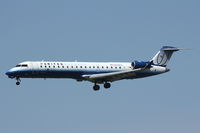 N519LR @ DFW - United Express landing at DFW Airport - by Zane Adams
