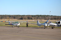 SE-LYI @ ESOW - Diamond DA-42 being tanked with Cessna 172RG SE-LKR waiting at Västerås Hässlö airport, Sweden. - by Henk van Capelle