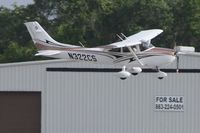 N322CS @ KLAL - Crosswind landing at Sun N Fun 2013 - Lakeland, FL