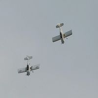 G-VFDS @ EGFH - Leading RV-8 G-EGRV out of a loop during formation aerobatics practice. - by Roger Winser