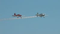 G-CGWG @ EGFH - Resident Vans. Flyby with Vans RV-8 G-EGRV with smoke on leading G-CGWG. - by Roger Winser