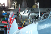 G-AIDN @ EGTB - tucked away at the back of the PPS hangar - by Chris Hall