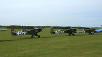 G-RRSR @ EGSU - 5. 480173 on the flightline with two more Piper at the IWM Spring Airshow, May 2013.