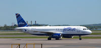 N806JB @ KDCA - Taxi DCA  Objects in the mirror are bluer than they appear - by Ronald Barker