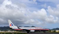 N879NN @ TNCM - Approaching rwy 10 for takeoff - by Dirk Fierens