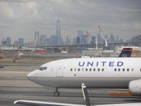 N77431 @ EWR - N77431 Nose with New York skyline in the background