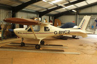 G-BYCZ @ EGBG - in the turntable hangar at Leicester - by Chris Hall