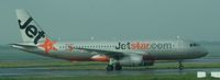 VH-VGU @ NZAA - cropped shot from domestic baggage area - by magnaman