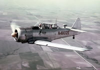 N4802E @ SUX - Photographed in flight West of Sioux City Municipal Airport (now Sioux Gateway airport), around 1964.  Pilot/Owner at that time was John J. Shinkunas. - by Greg Shinkunas