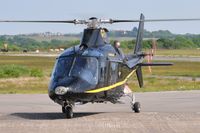 G-TELY @ EGFH - Visiting Agusta A109 helicopter operated by Castle Air Ltd. - by Roger Winser